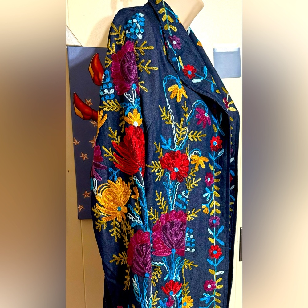 Anu Sz S.   Heavily and intricately embroidered mid-thigh embroidered jacket.
